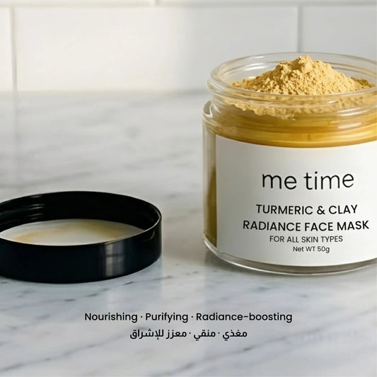 me time Turmeric and clay radiance face mask jar with open lid on a marble surface