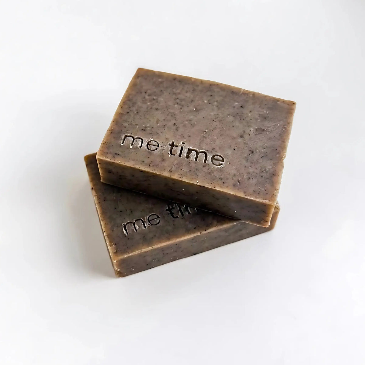 Black Seed natural handmade soap bar with black seed oil and ground seeds, photographed on a neutral background, cold-process texture visible, minimal packaging.