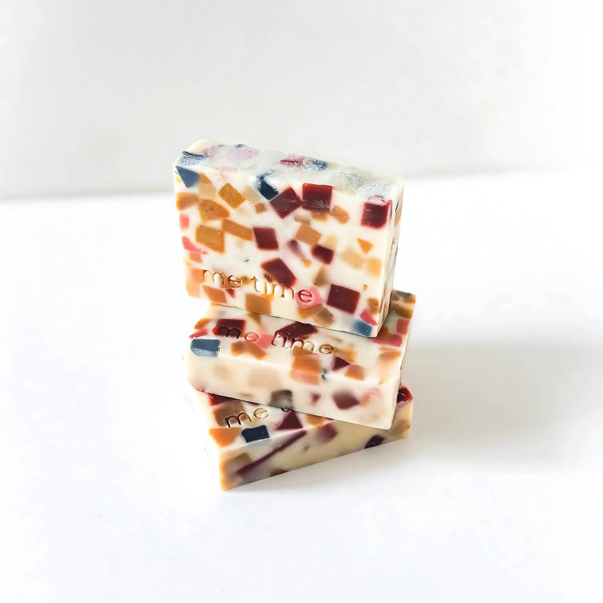 Zoom on the smooth, creamy surface of the bar, showing natural oils and slight texture of kaolin clay.