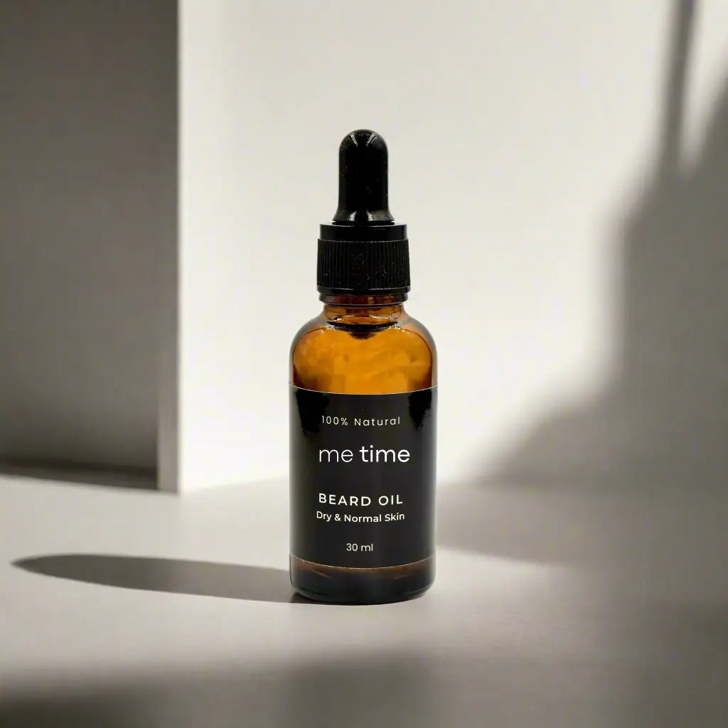 Bottle of beard oil with natural botanicals around it