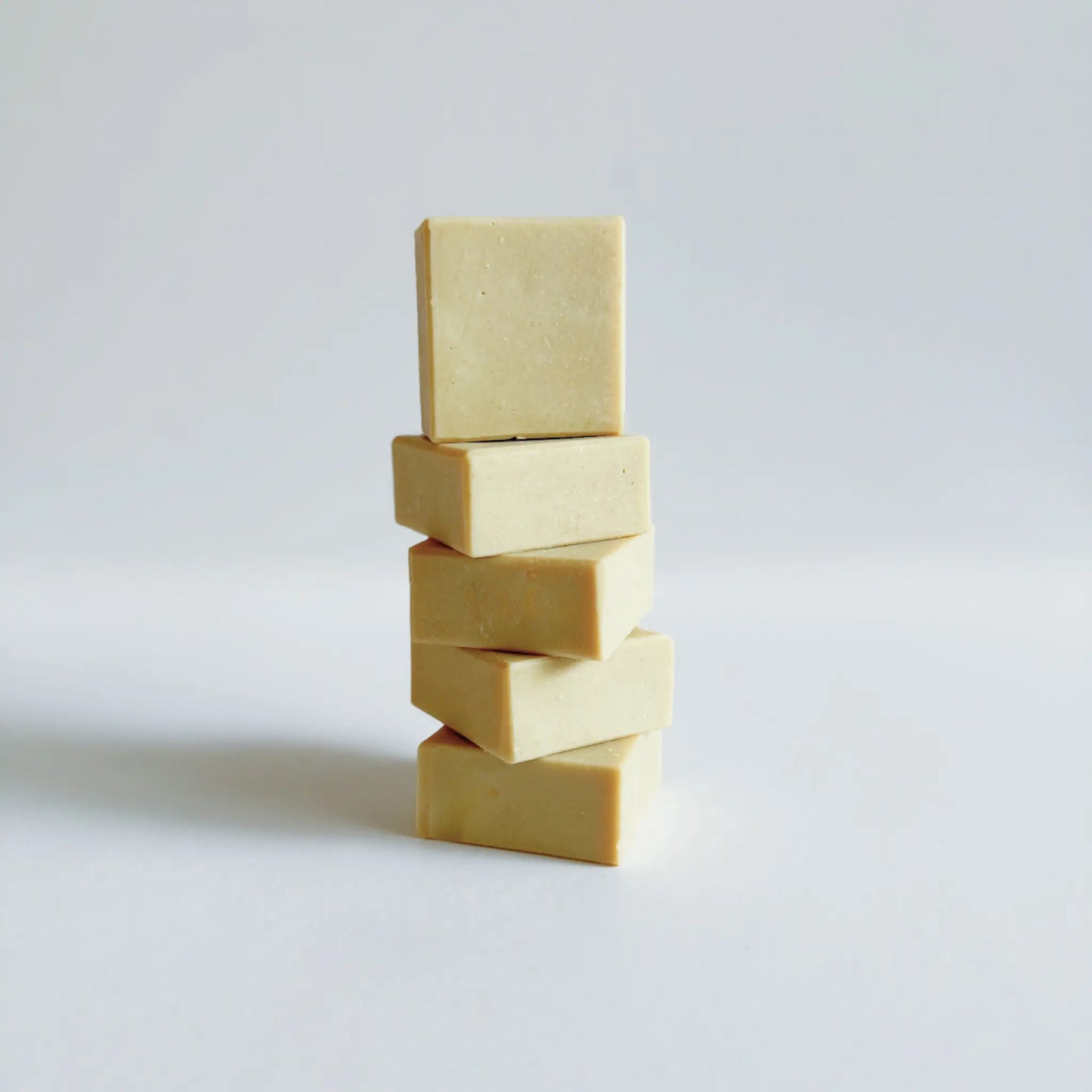 Close-up of a mini soap bar showing creamy texture and gentle pastel tone.