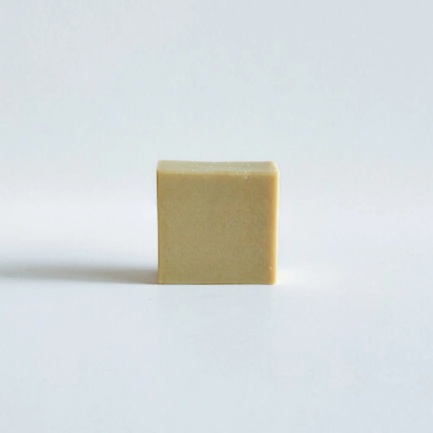 Set of six baby soap mini bars in minimal eco-friendly packaging, soft natural background, premium natural feel.