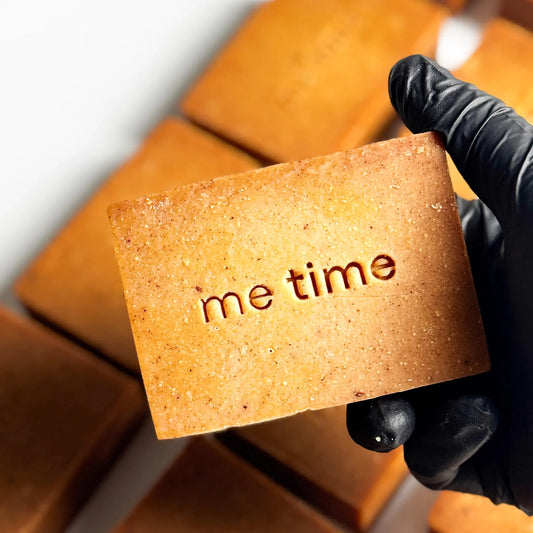 Turmeric natural handmade soap bar with warm golden tones, enriched with turmeric oil and citrus essential oils, photographed on a clean neutral background.