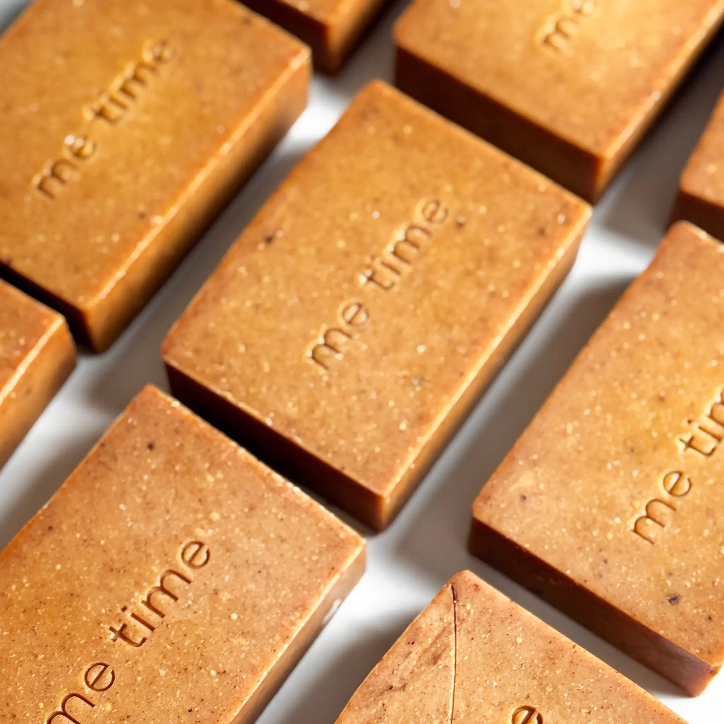 Handcrafted Radiance Turmeric Soap bar made with natural turmeric powder, olive oil, coconut oil, and citrus essential oils. Designed to brighten and nourish skin for a radiant glow.