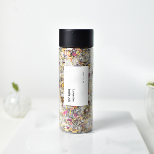 Jar of lavender bath salt with visible flowers, neutral soft background, natural lighting, artisan premium style.