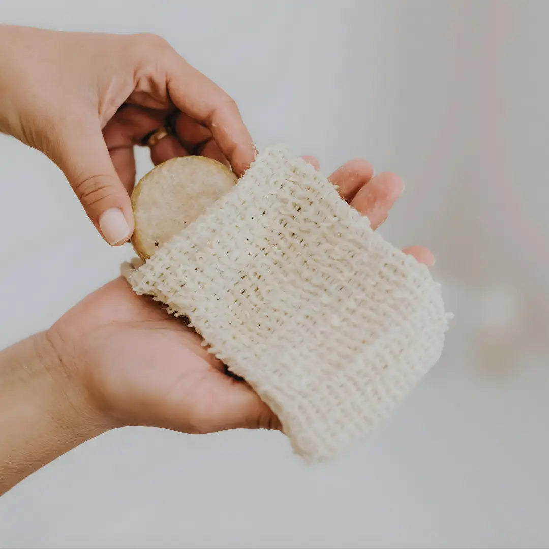 Exfoliating soap pouch detail — cotton linen weave, plastic-free skincare accessory, UAE