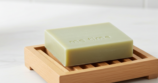 Handcrafted natural soap on wooden surface with soft water lather, promoting mindful daily skincare in UAE