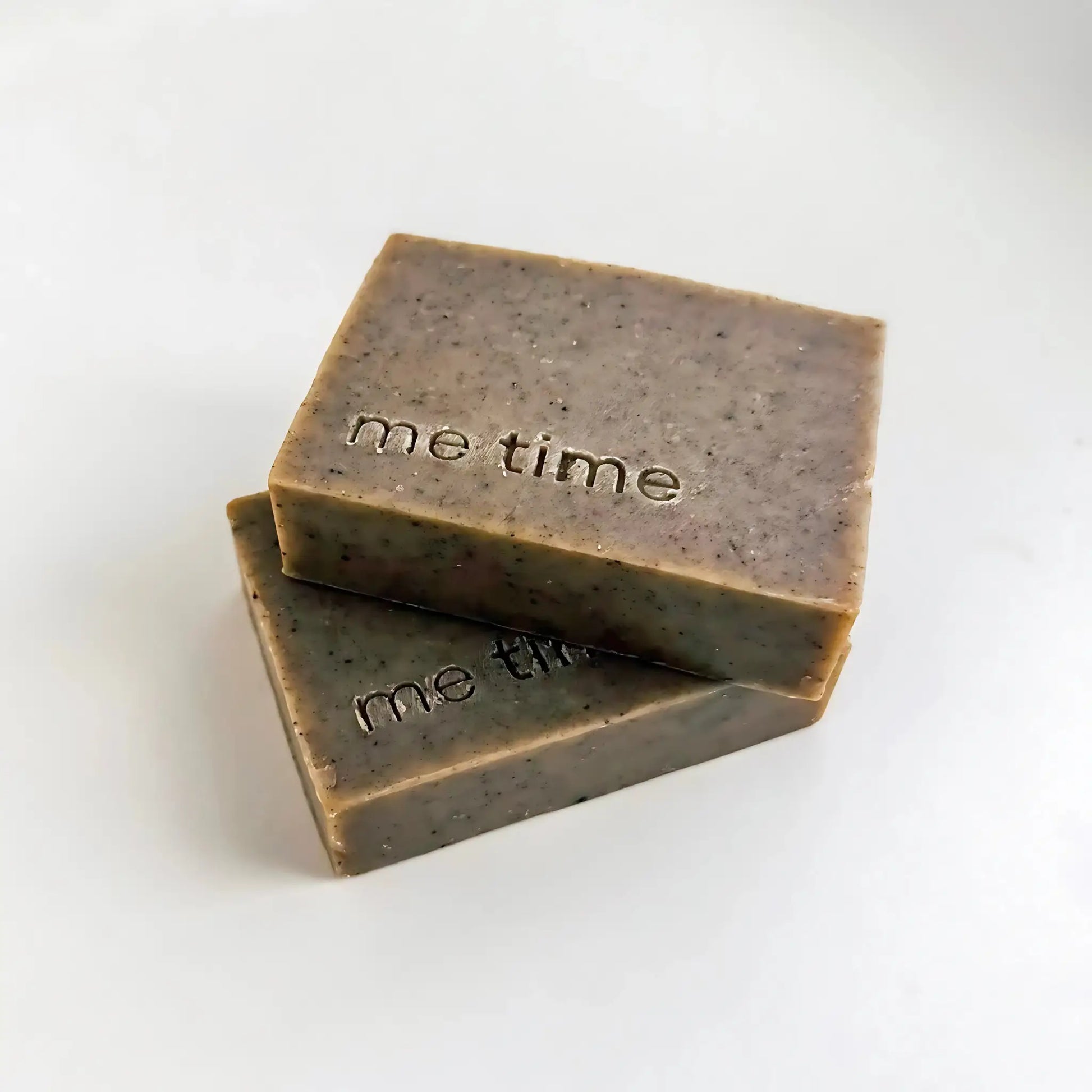Two bars of soap with 'me time' text on a white background