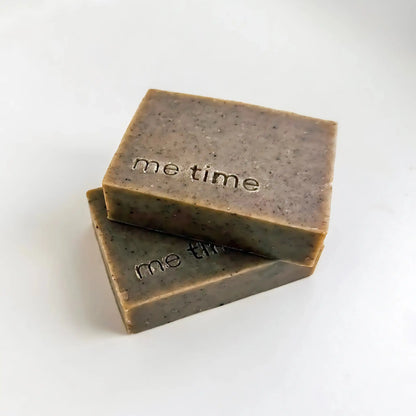 Two bars of soap with 'me time' text on a white background