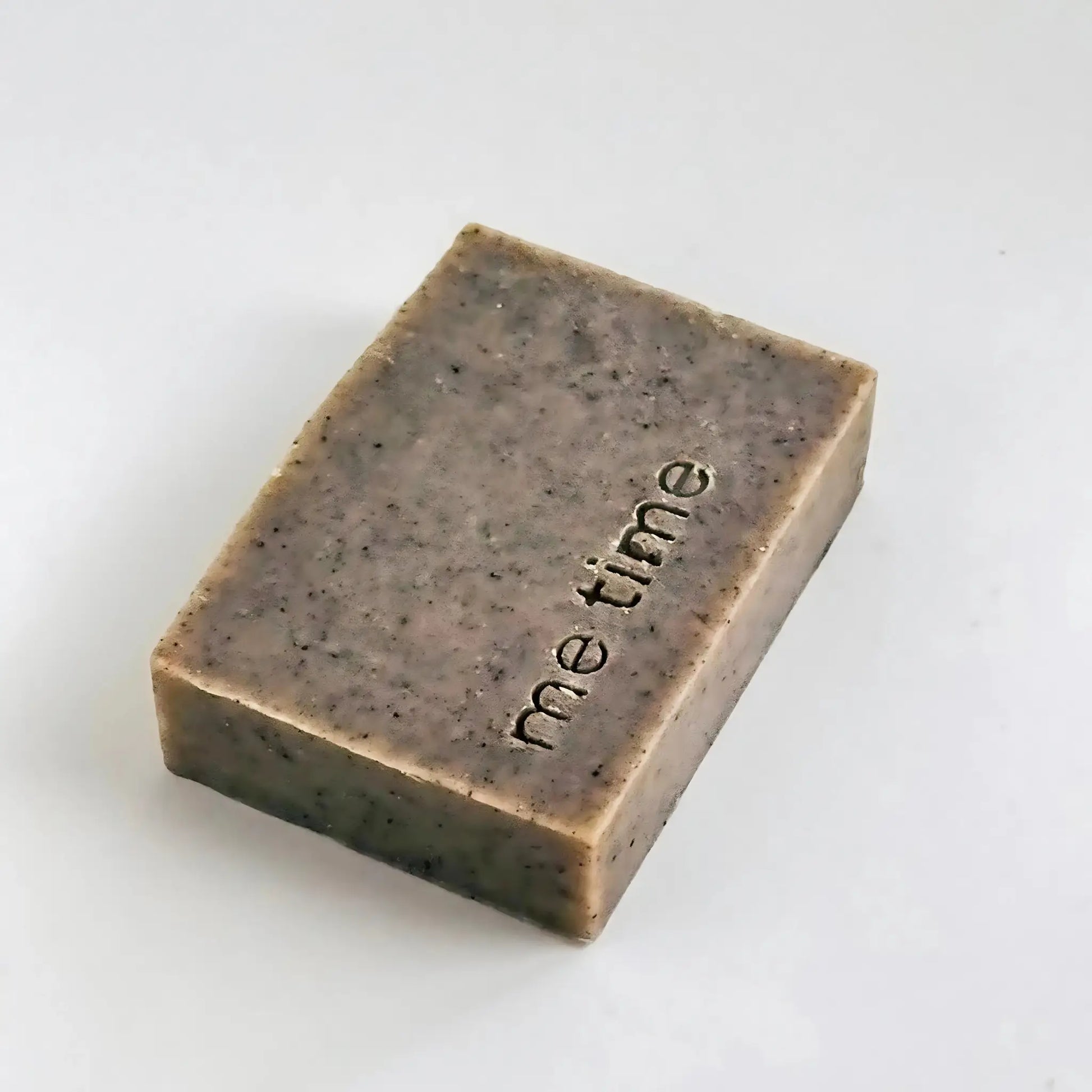 Close-up of exfoliating Black Seed Soap – luxury handmade skincare in natural light