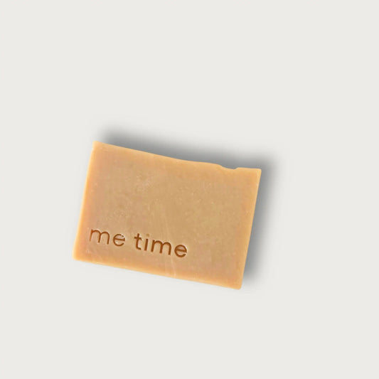 Camel Milk Bar of soap with 'me time' text on a light gray background