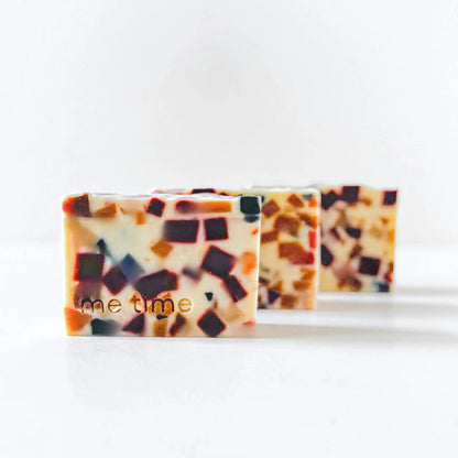 Zoom on the smooth, creamy surface of the bar, showing natural oils and slight texture of kaolin clay.