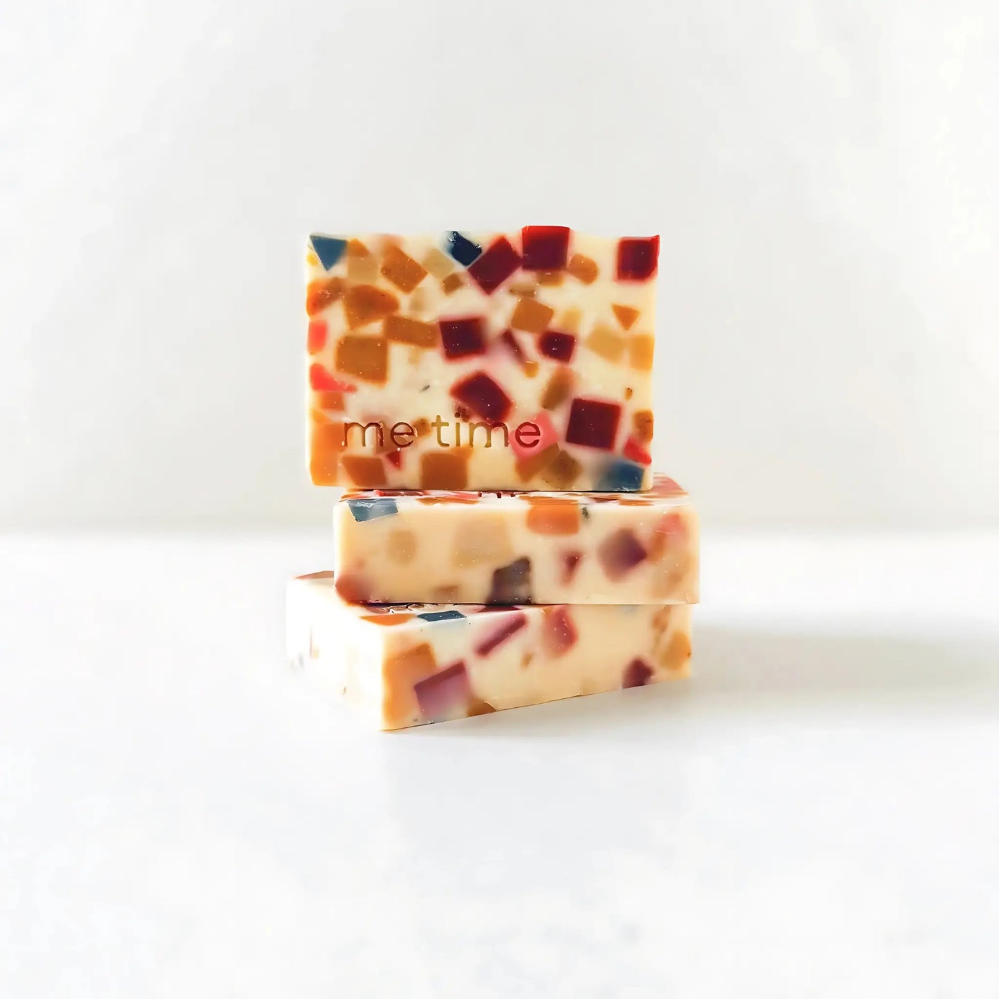 Zoom on the smooth, creamy surface of the bar, showing natural oils and slight texture of kaolin clay.