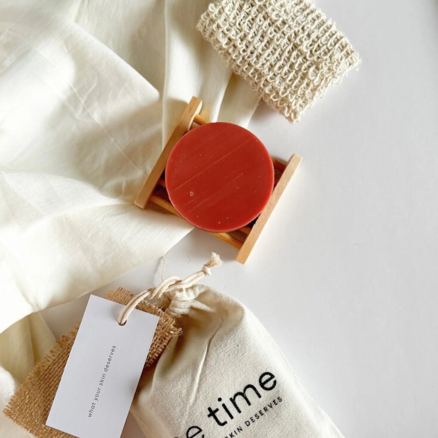 Bamboo soap dish and exfoliating pouch included in theDaily Care Set 