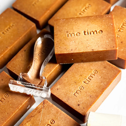 Turmeric natural handmade soap bar with warm golden tones, enriched with turmeric oil and citrus essential oils, photographed on a clean neutral background.