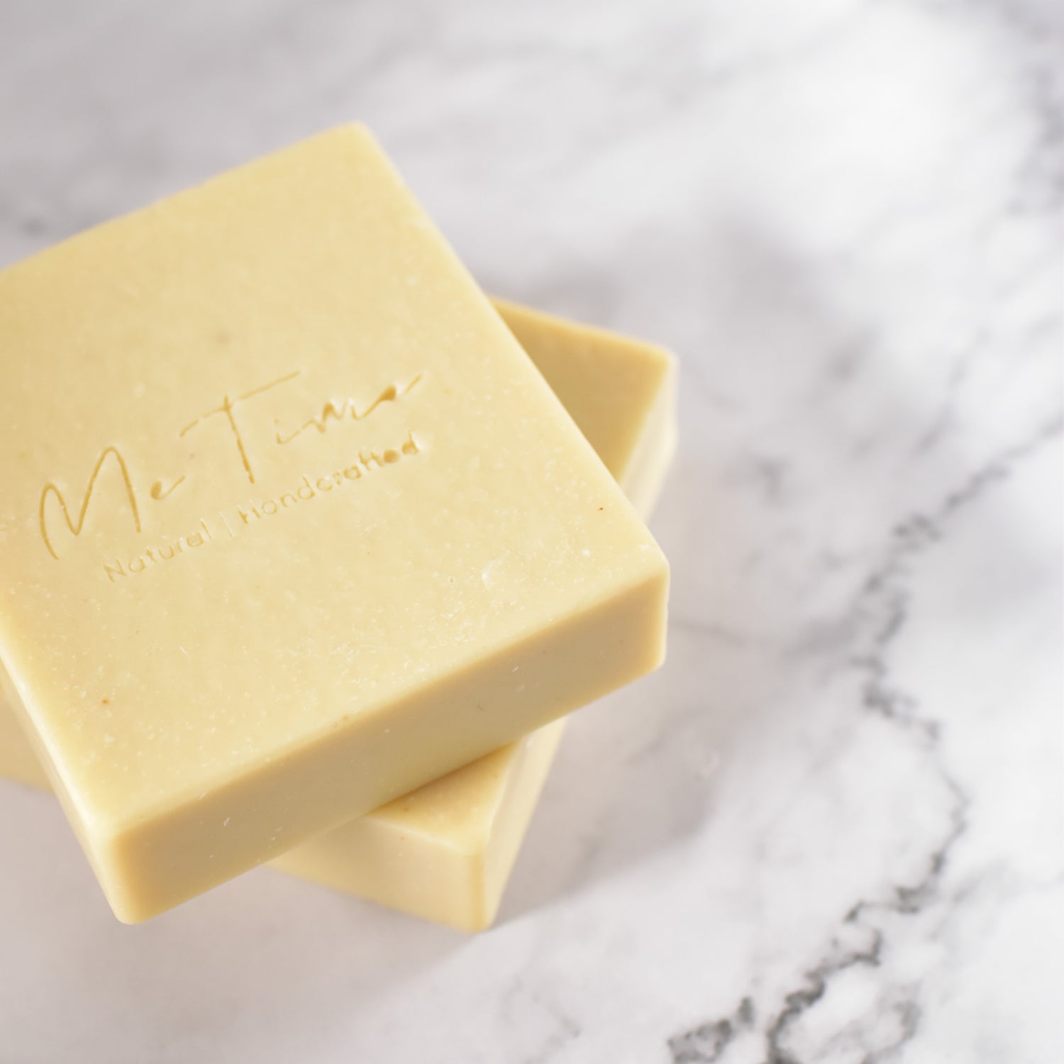 Handmade bentonite clay soap bar with soft earthy tones, enriched with natural oils, photographed on a neutral background.