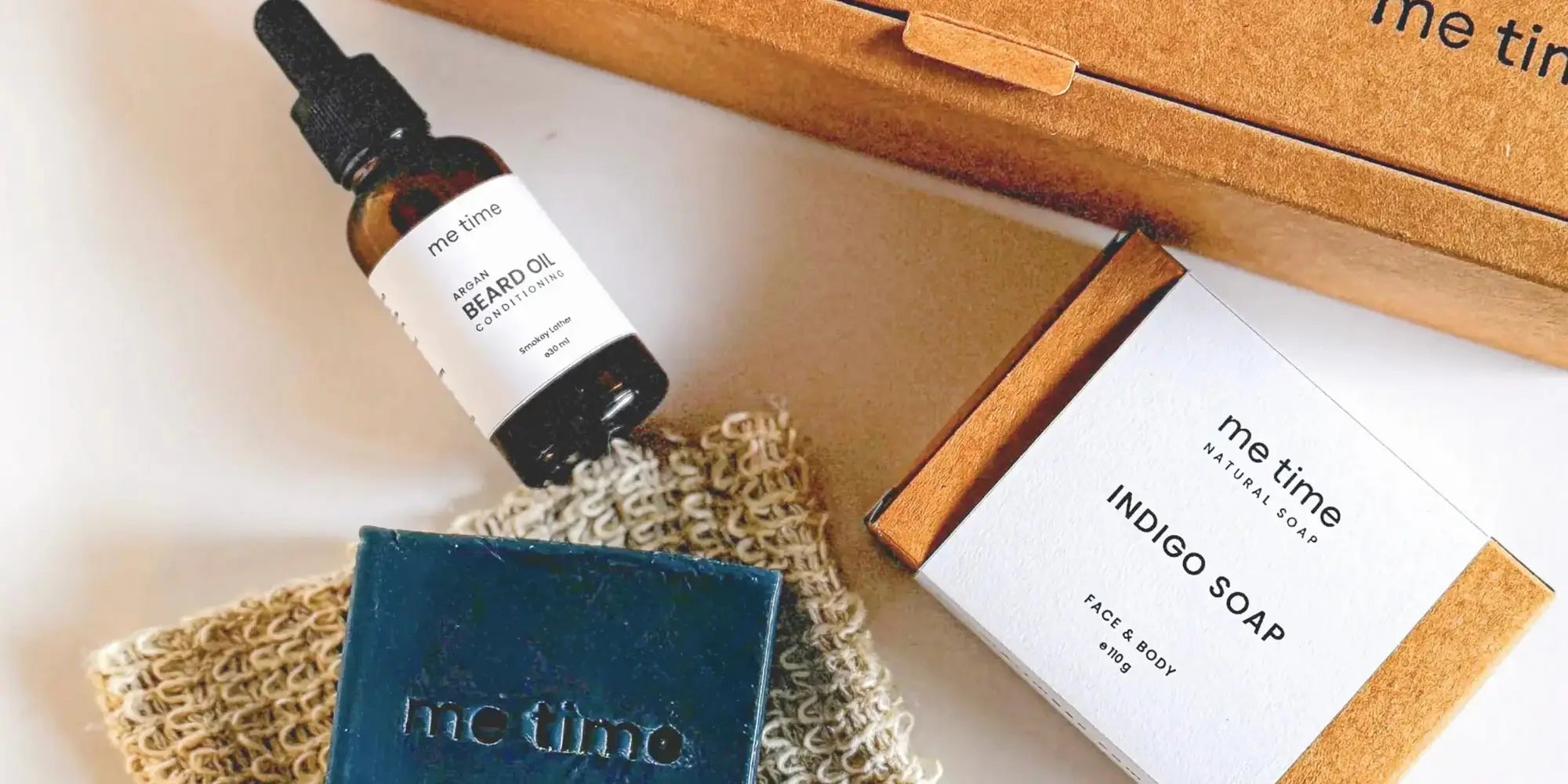The Ultimate Self-Care Kit for Him – A luxurious men's grooming gift set featuring handcrafted Indigo Artisan Soap, Argan Conditioning Beard Oil, and an Exfoliating Soap Pouch. 100% natural, eco-friendly, and designed for deep hydration, nourishment, and relaxation