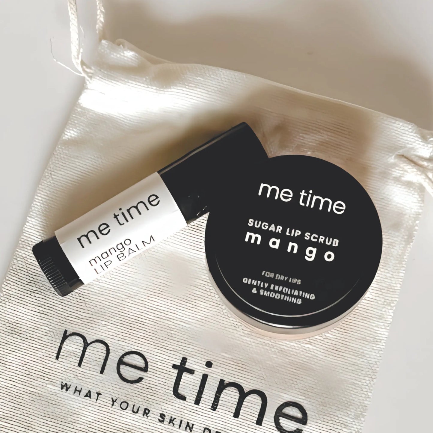 The Lip Set set with lip balm, exfoliating lip scrub, and premium cotton bag