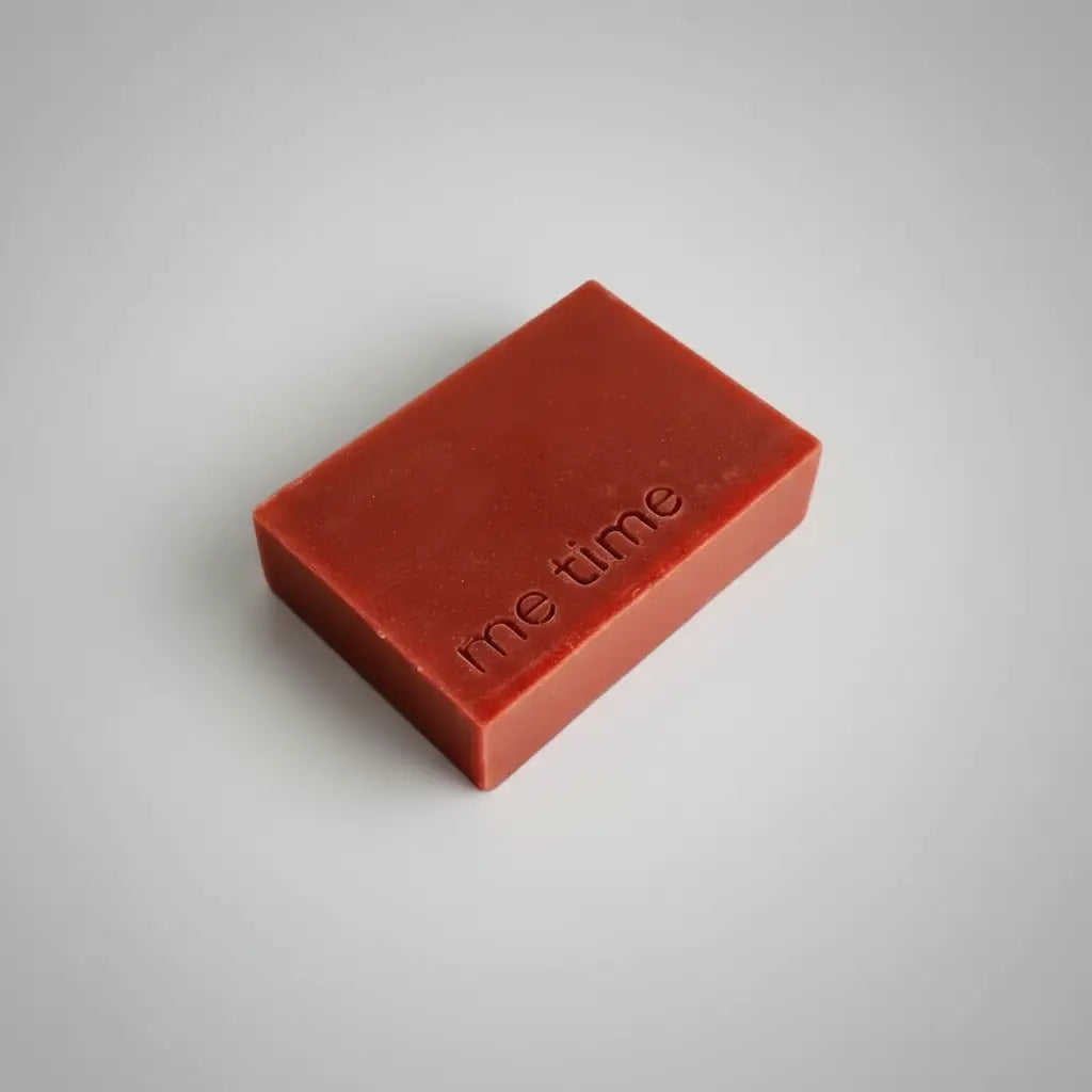 Autumn Bloom natural handmade soap bar in warm earthy tones, infused with rhubarb powder, on a neutral background, minimal packaging, cold‑process texture visible.