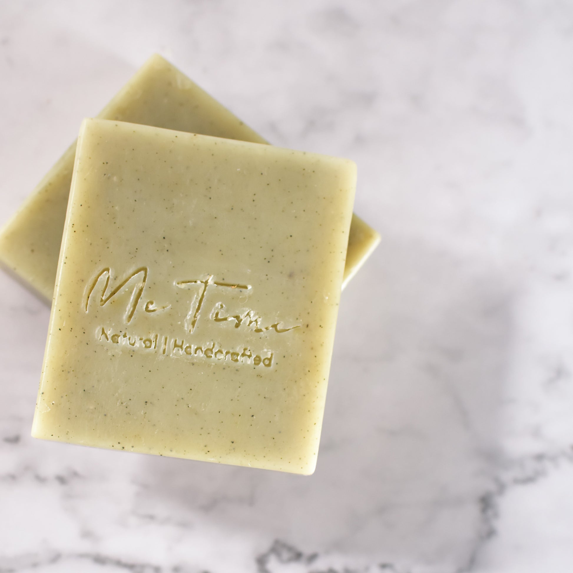 Handmade spirulina soap bar with soft green tone, enriched with mango butter and natural oils, photographed on a neutral background.
