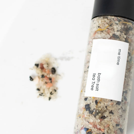 Bottle of bath salts labeled 'me time' with a visible label on a white background