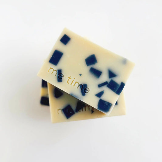 Handmade Midnight Mosaic natural soap with navy blue pieces on a light grey background – clove bud, patchouli, lavender blend.