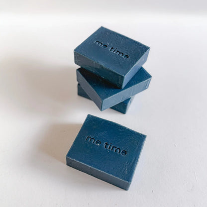 Indigo natural handmade soap bar with deep blue tones, enriched with indigo powder and essential oils, photographed on a clean neutral background, cold-process texture visible, minimal packaging.
