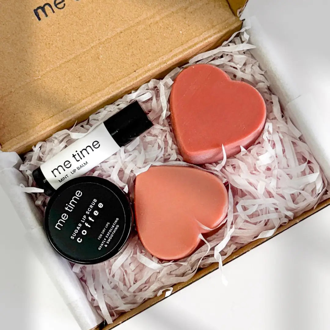 Pamper Me Gift Box – A handmade self-care set featuring heart-shaped soaps, lip balm, lip scrub, and a surprise product.