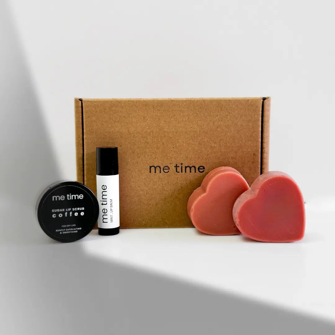 Pamper Me Gift Box – A handmade self-care set featuring heart-shaped soaps, lip balm, lip scrub, and a surprise product.