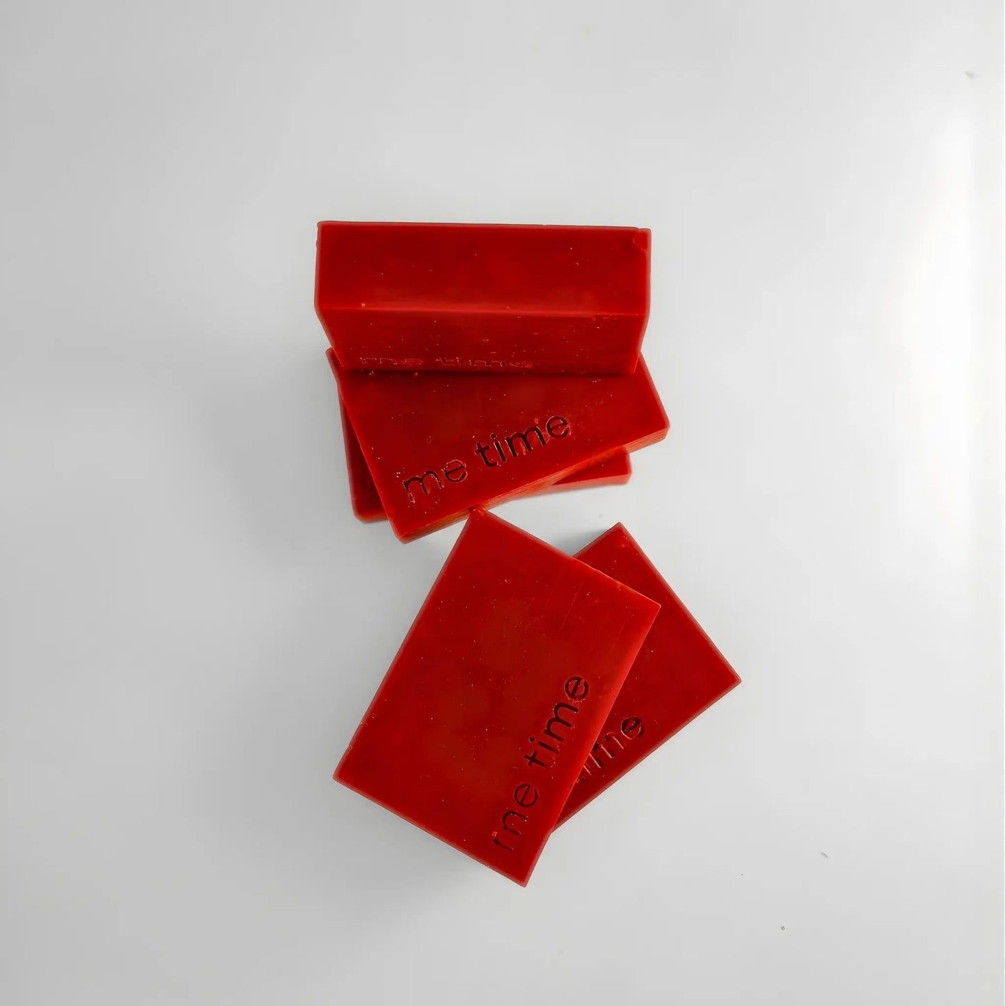 Rhubarb rectangular soaps with 'the time' embossed on them on a white background