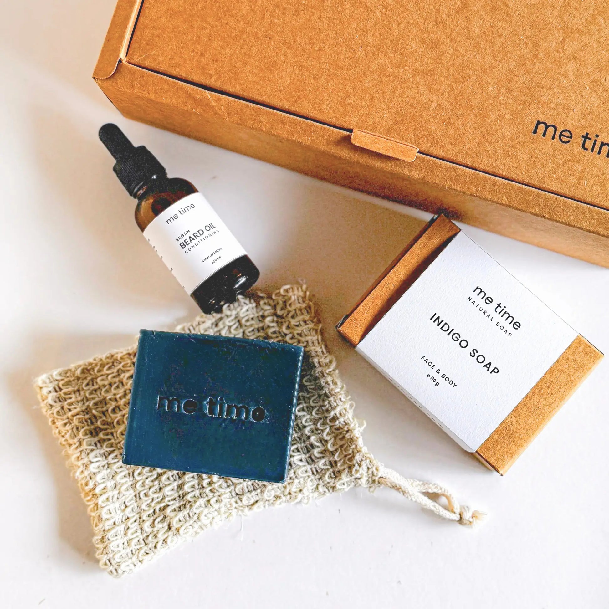 The Ultimate Self-Care Kit for Him – A luxurious men's grooming gift set featuring handcrafted Indigo Artisan Soap, Argan Conditioning Beard Oil, and an Exfoliating Soap Pouch. 100% natural, eco-friendly, and designed for deep hydration, nourishment, and relaxation