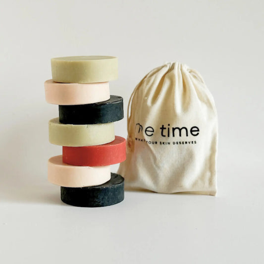 Quiet Garden soap gift set with four handcrafted soaps wrapped in tissue and a reusable cotton bag