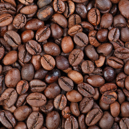 Close-up of roasted coffee beans with a rich brown color.