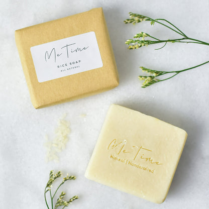 Handmade natural artisan soap bar with rice and rice water, featuring gentle exfoliation and deep hydration properties. The soap is crafted with palm oil, olive oil, coconut oil, and castor oil, with a natural rice fragrance.